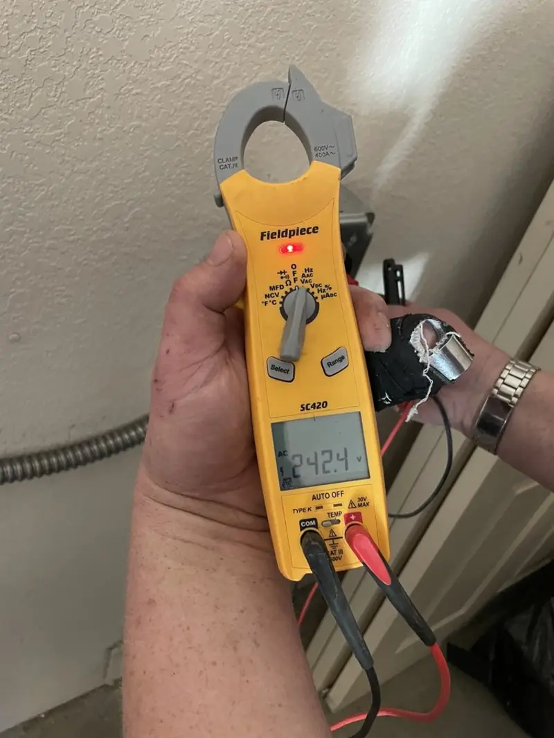 Voltage testing with clamp meter during Generator Installation in Clover Creek